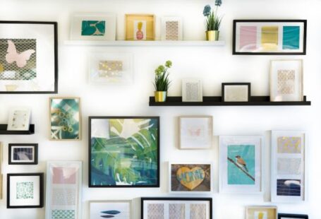 Photo Frames - assorted-color framed paintings on the wall