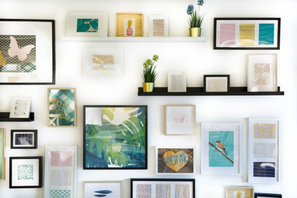 Photo Frames - assorted-color framed paintings on the wall