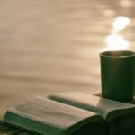 Cozy Reading Nook - green ceramic mug beside book