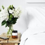 Artful Decor - flowers in clear glass vase on table