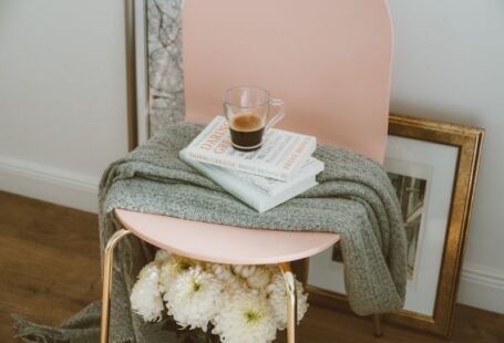 Quick Decor Tips - clear glass mug on three stacked books inside room