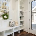 Shelves - gray and white floral throw pillow beside rack inside room