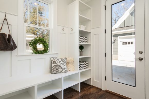 Shelves - gray and white floral throw pillow beside rack inside room