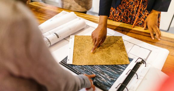 Flooring Selection. - Women Pointing Fingers on Material Samples