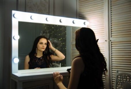 Mirror In Wardrobe - woman wearing black sleeveless top