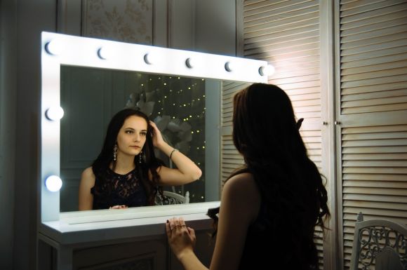 Mirror In Wardrobe - woman wearing black sleeveless top