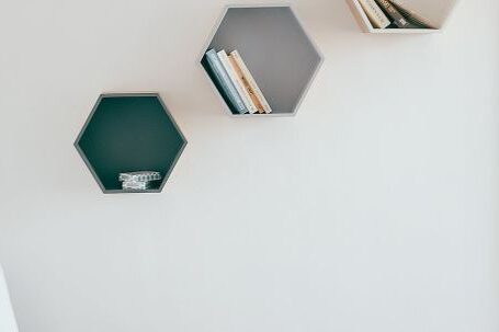 Interior Design - Wooden White Armchair Beside a Small Round Table