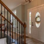 Real Estate - Brown Wooden Staircase With Brass Chandelier