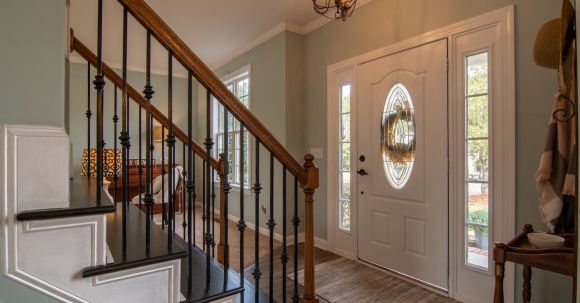 Real Estate - Brown Wooden Staircase With Brass Chandelier