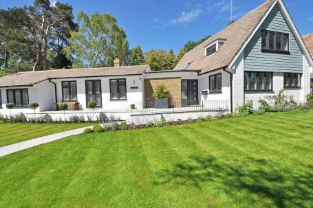 Real Estate - White Wooden 2-storey House Near Tree