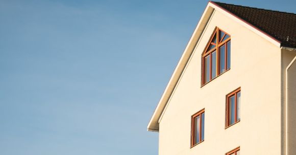 Property - Beige Concrete House Under Cumulus Cloud