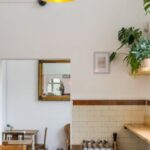 Interior Design - An Eatery with Wooden Tables and Chairs