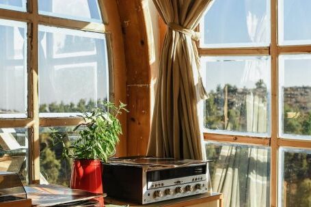 Interior Design - Black Music Player on Brown Wooden Desk