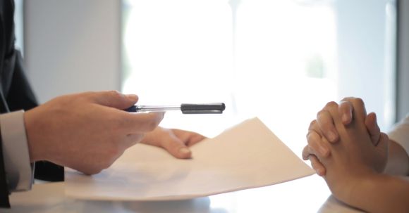 Property - Crop businessman giving contract to woman to sign