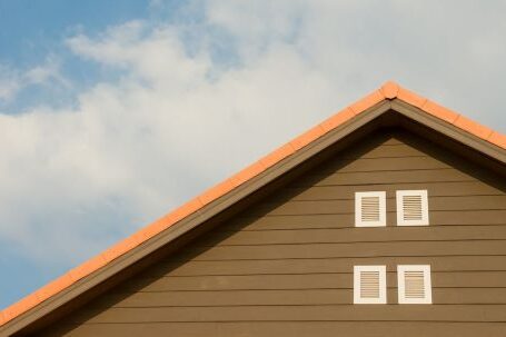 Property - Orange and Gray Painted Roof Under Cloudy