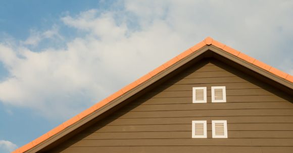 Property - Orange and Gray Painted Roof Under Cloudy
