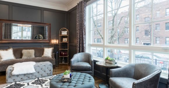 Real Estate - Round Tufted Gray Ottoman