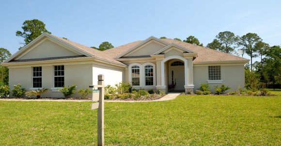 Real Estate - White and Brown Concrete Bungalow Under Clear Blue Sky