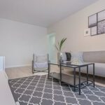 Real Estate - Three Gray Ornaments on White Wooden Desk Inside Living Room