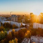Real Estate - Aerial View of White Concrete Buildings during Golden Hours
