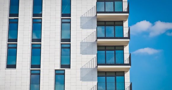 Real Estate - Low-angle Photography of Gray Concrete Building