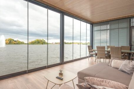 Luxury Properties - Interior of contemporary house on lake on cloudy day