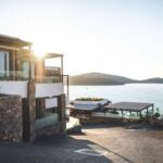 Real Estate - Sun Piercing of Brown Concrete House Near Sea