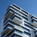 Real Estate - White Concrete Building Under Sunny Blue Sky