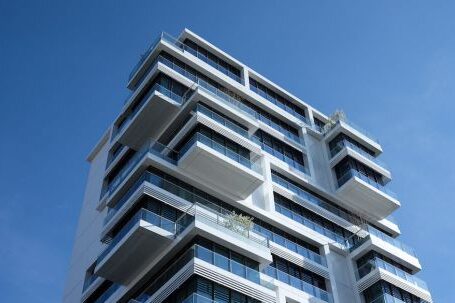 Real Estate - White Concrete Building Under Sunny Blue Sky