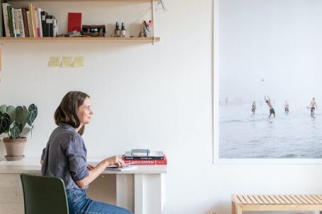 Interior Design - Woman Sitting at a Desk in a Modern Room at Home