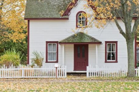 Property - White and Red Wooden House With Fence