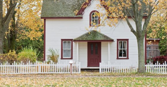 Property - White and Red Wooden House With Fence