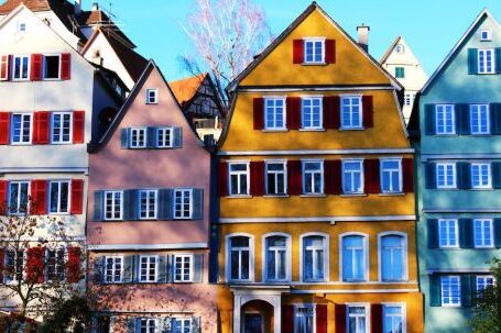 Property - White, Pink, Yellow, and Teal Painted Houses