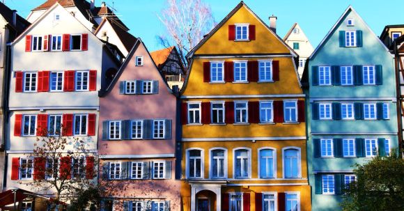 Property - White, Pink, Yellow, and Teal Painted Houses