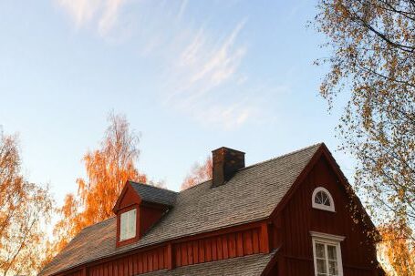 Property - Red and Black Wooden House Under Blue Sky