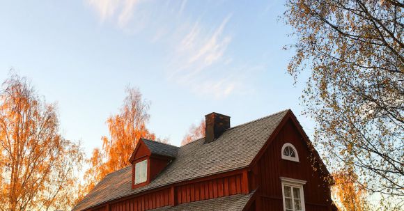 Property - Red and Black Wooden House Under Blue Sky