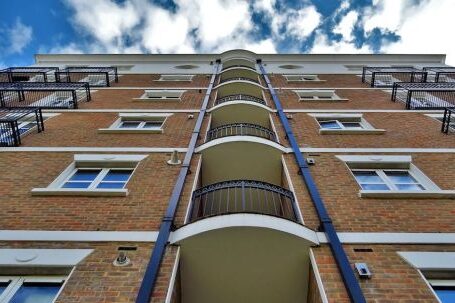 Property - Low Angle Photography of Brown Brick Building