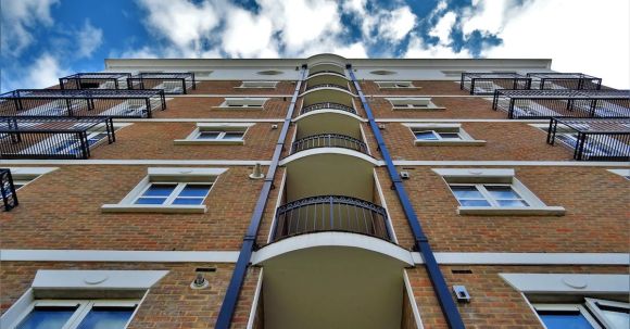 Property - Low Angle Photography of Brown Brick Building
