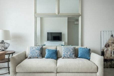 Luxury Properties - Sofa with cushions in living room