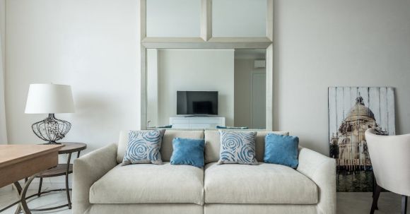 Luxury Properties - Sofa with cushions in living room