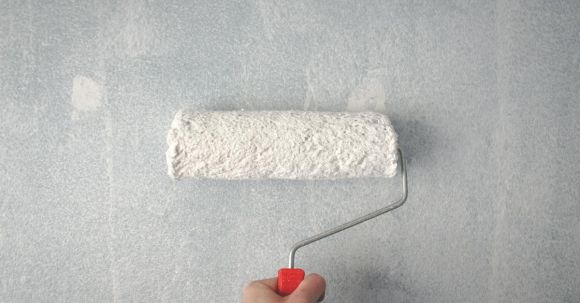 Painting Wall - Person Holding Paint Roller On Wall