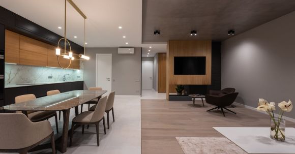 Luxury Properties - Dining room with table and near open plan kitchen