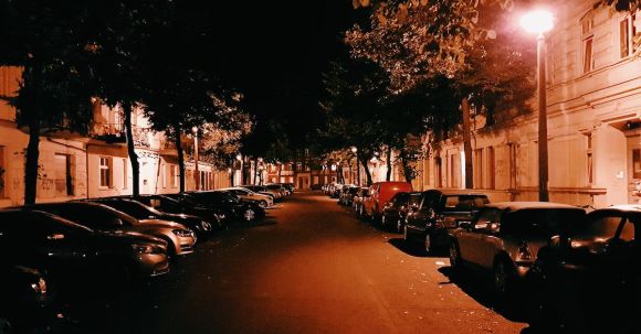 Neighborhood - Assorted Cars Parking on Street during Nighttime