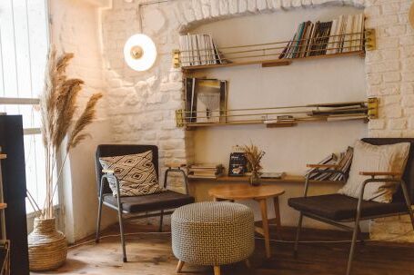 Home - Round Brown Wooden Table Between Two Chairs and Ottoman Chair