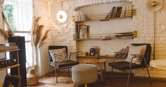 Home - Round Brown Wooden Table Between Two Chairs and Ottoman Chair