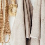 Sustainable Homes - Set of body care tools with towels on hanger