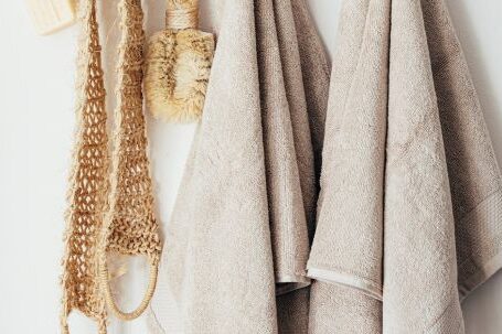 Sustainable Homes - Set of body care tools with towels on hanger