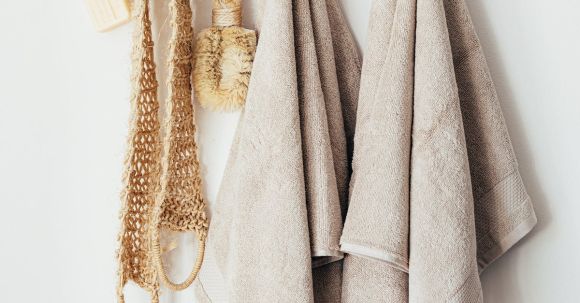 Sustainable Homes - Set of body care tools with towels on hanger