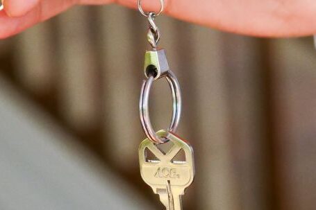 New Home - Person Holding a Keychain with Key