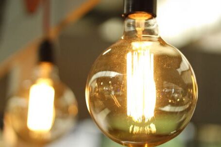 Energy Efficiency - Lighted Light Bulb in Selective-focus Photography